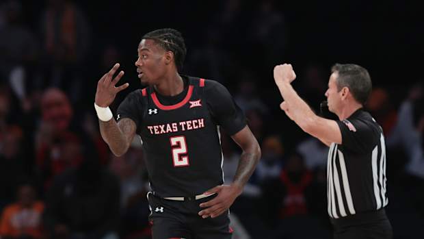 Dec 7, 2021; New York, New York, USA; Texas Tech Red Raiders guard Davion Warren (2) reacts after making a three point basket against the Tennessee Volunteers during the first half at Madison Square Garden. Mandatory Credit: Vincent Carchietta-USA TODAY Sports